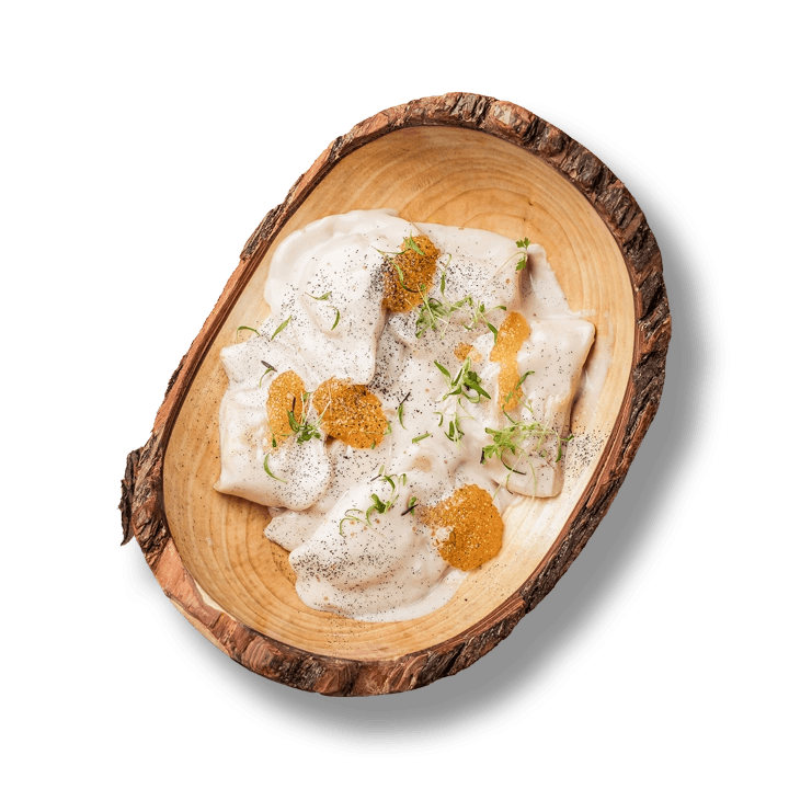 Dumplings with carp and smoked sauce with pike caviar