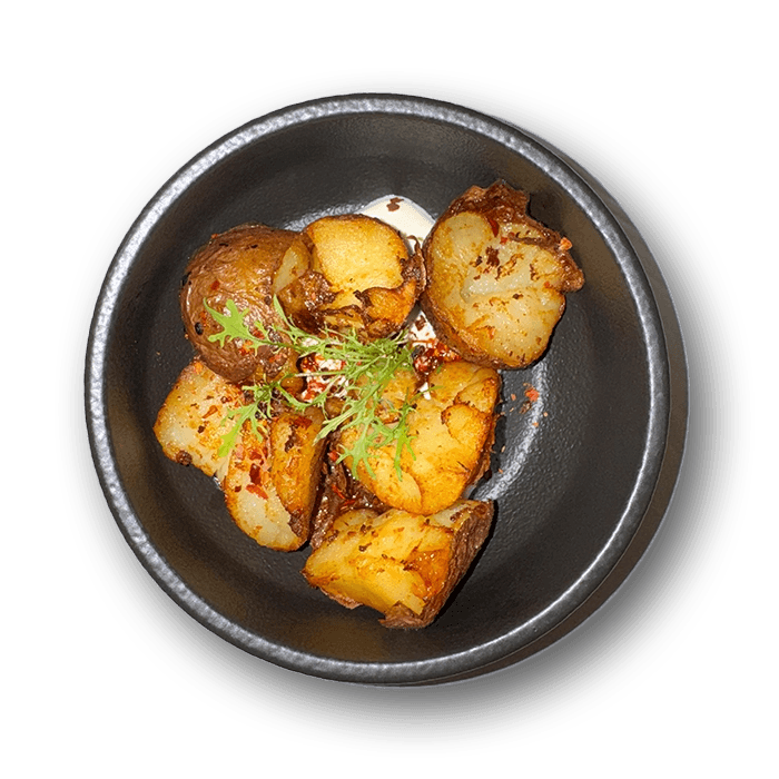 Fried potatoes with sour cream, traditional serving