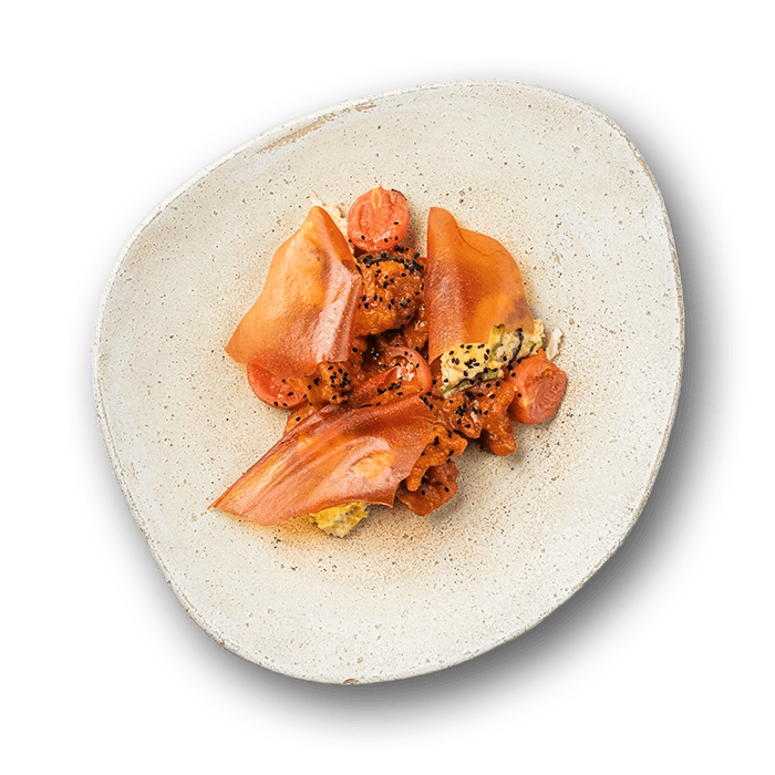 Fried carp in candied sauce with Kulish garnish and tomato lamants