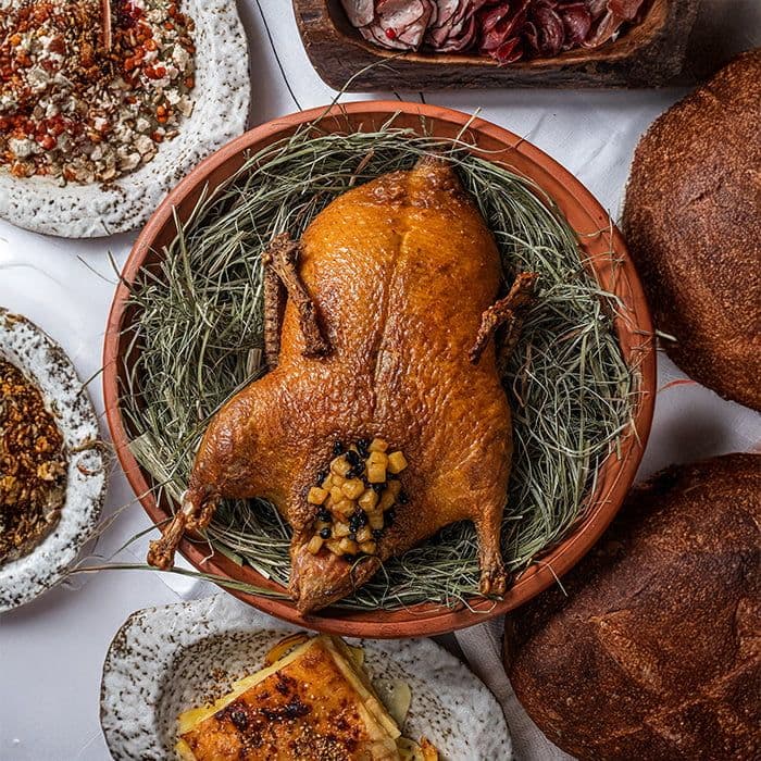 Roasted duck stuffed with barberries and apples