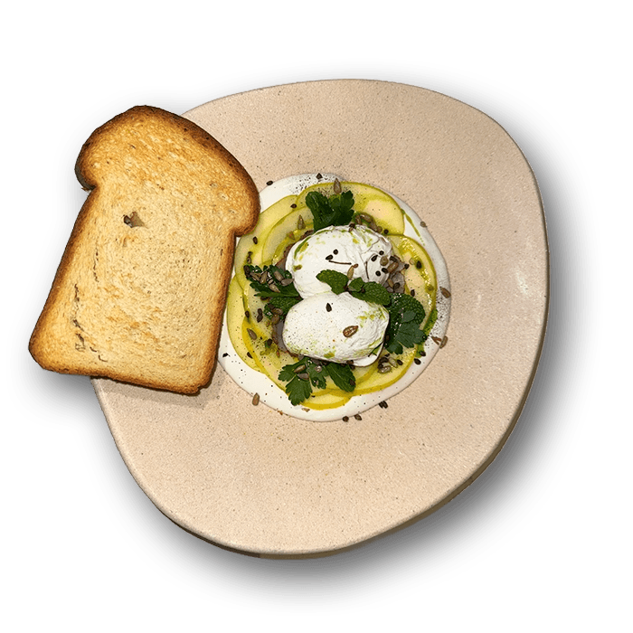 Hamula breakfast with poached eggs, forest char, and cream cheese