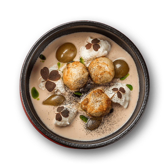 Pike sichenyky with buckwheat milk, roasted onion jus, and grapes